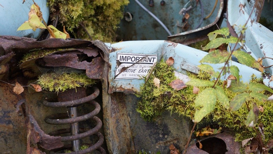 forgotten mossy scrap metal in the forest