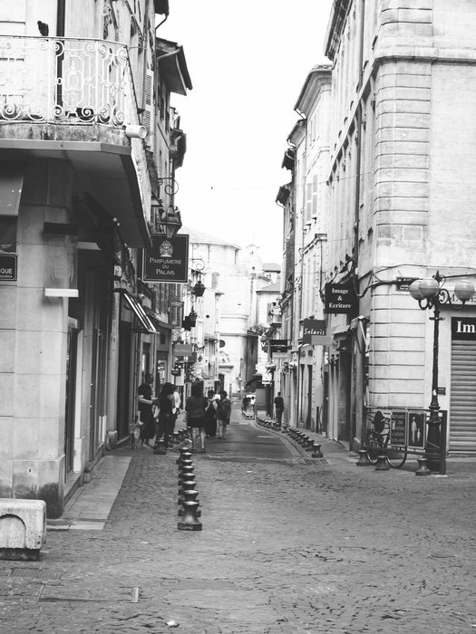 grey photo of street in France