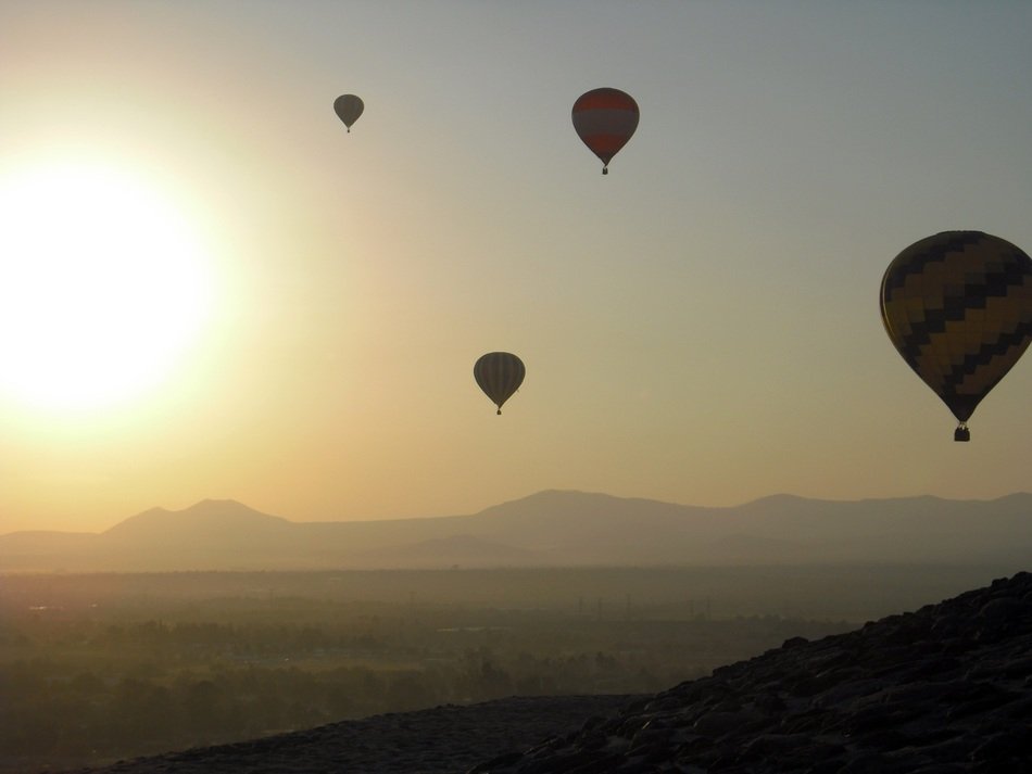 balloons in the sky during sunset