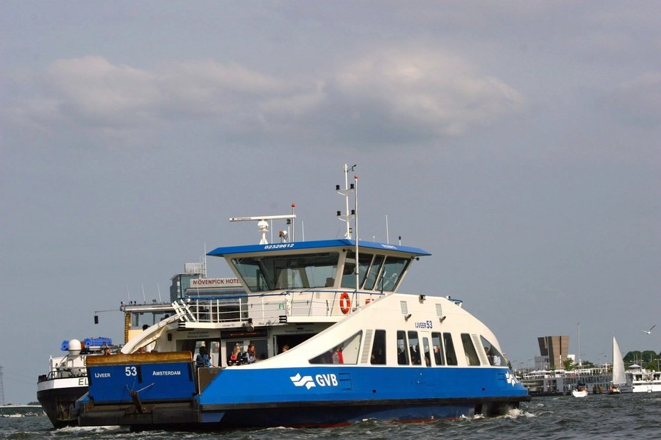 boat on the water in the harbor of amsterdam