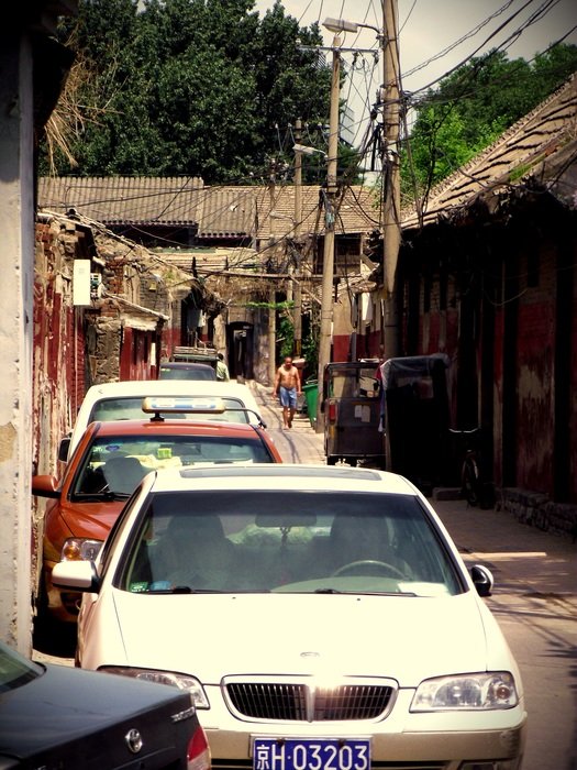 cars stand near the wall in china