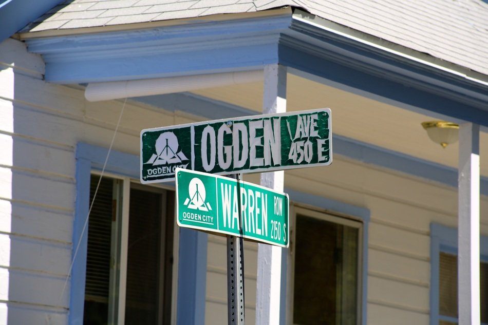 pole with address of destination, street sign