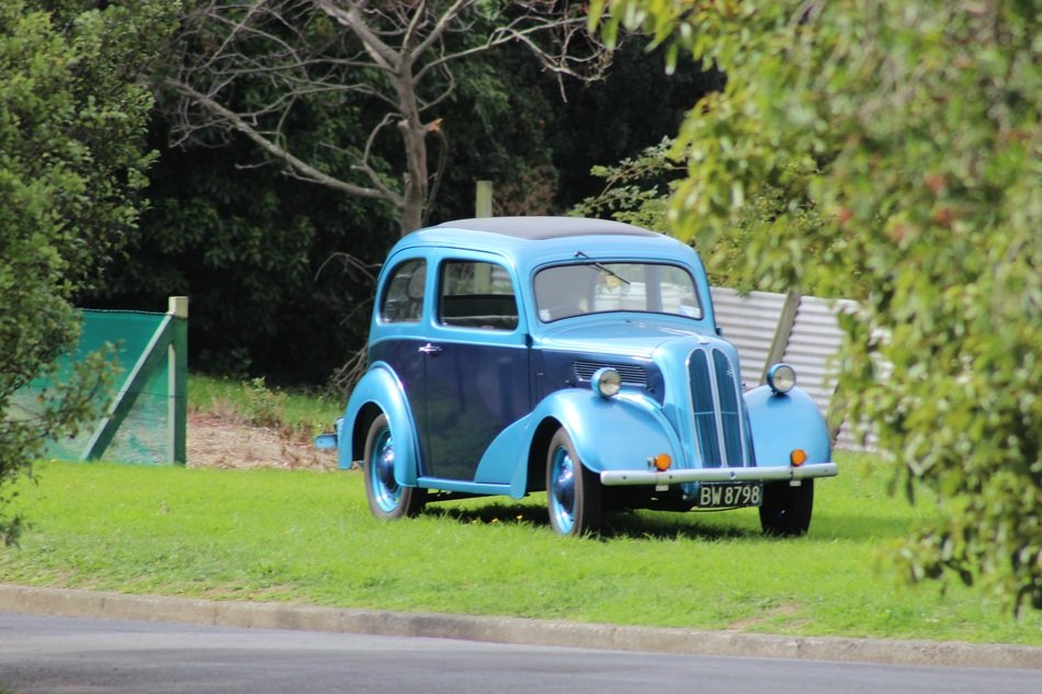 vintage blue car on lawn
