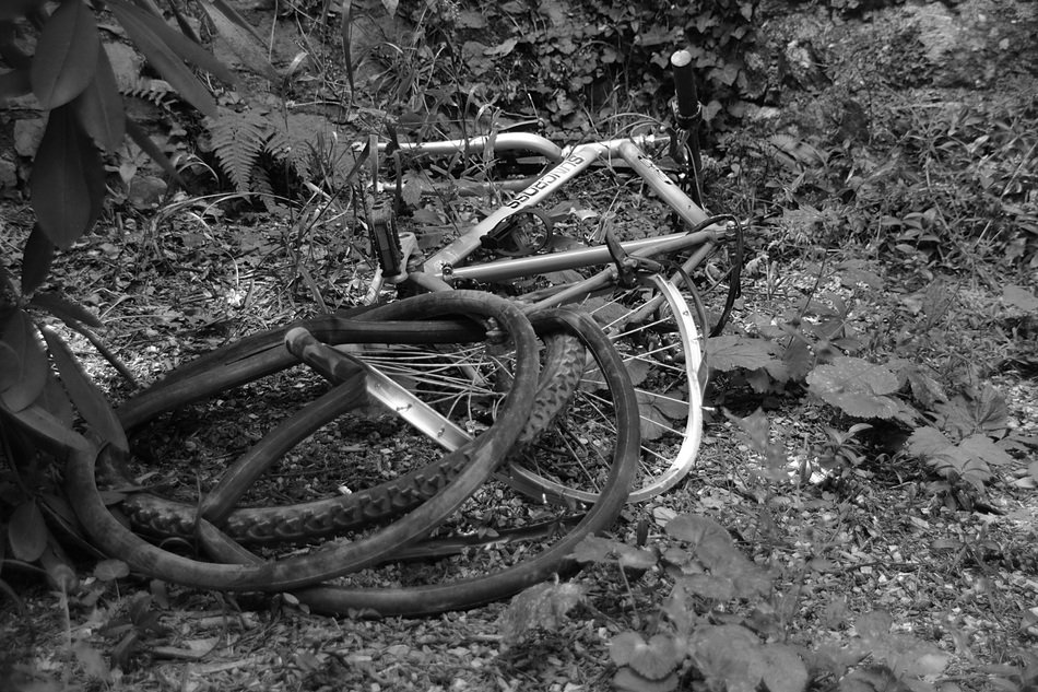 old broken bike in black and white image