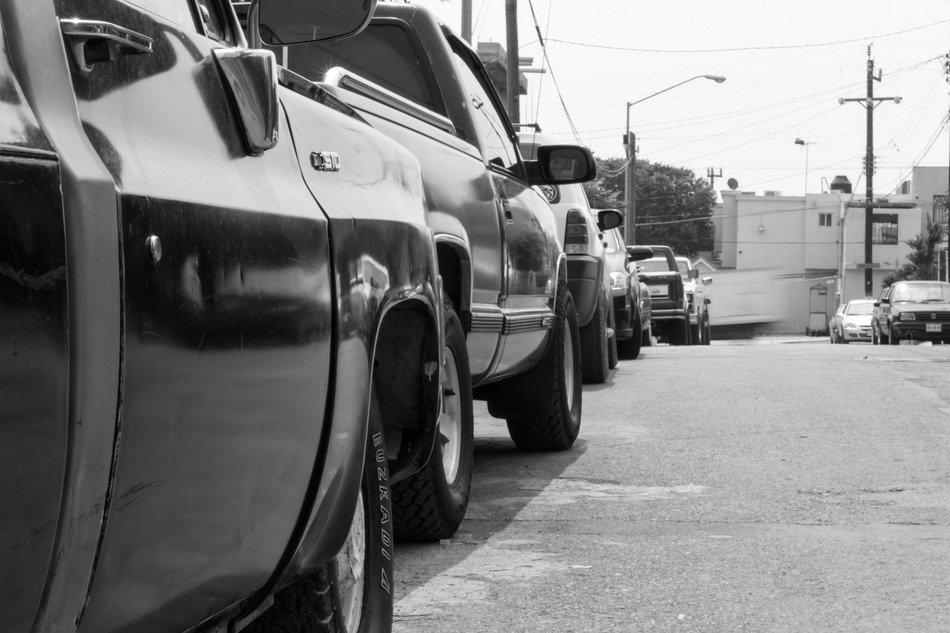 cars on the street in black and white background