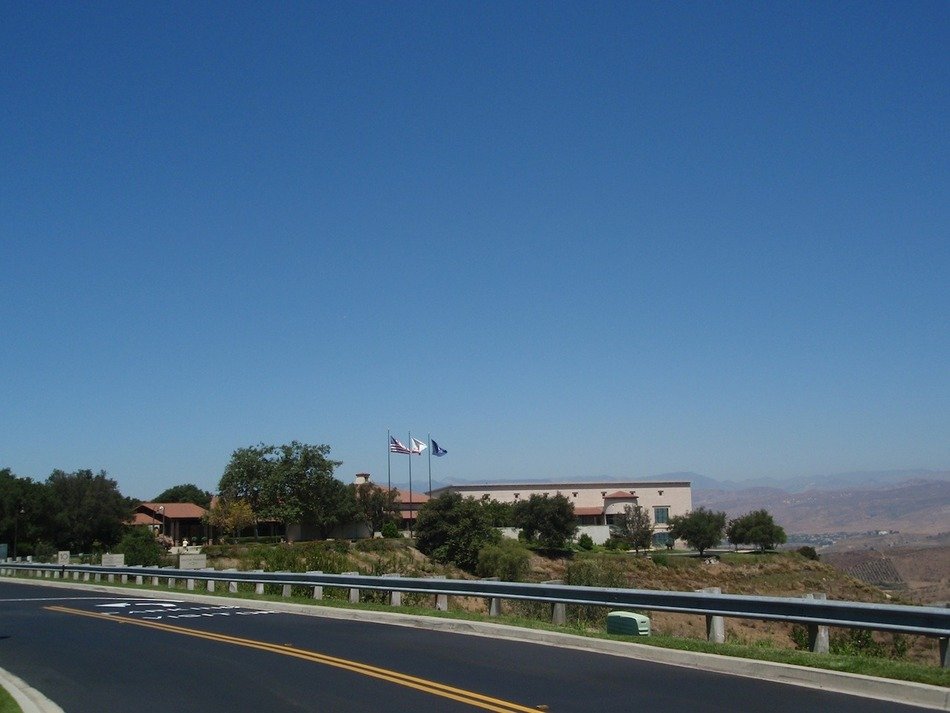 view from the highway to the building with flags