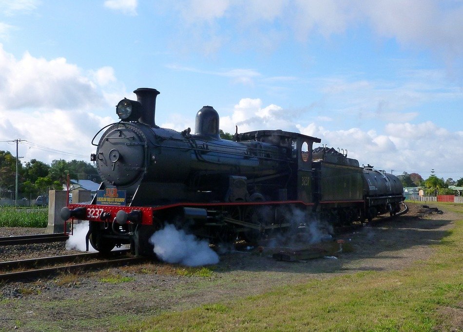 steam train speeding in countryside