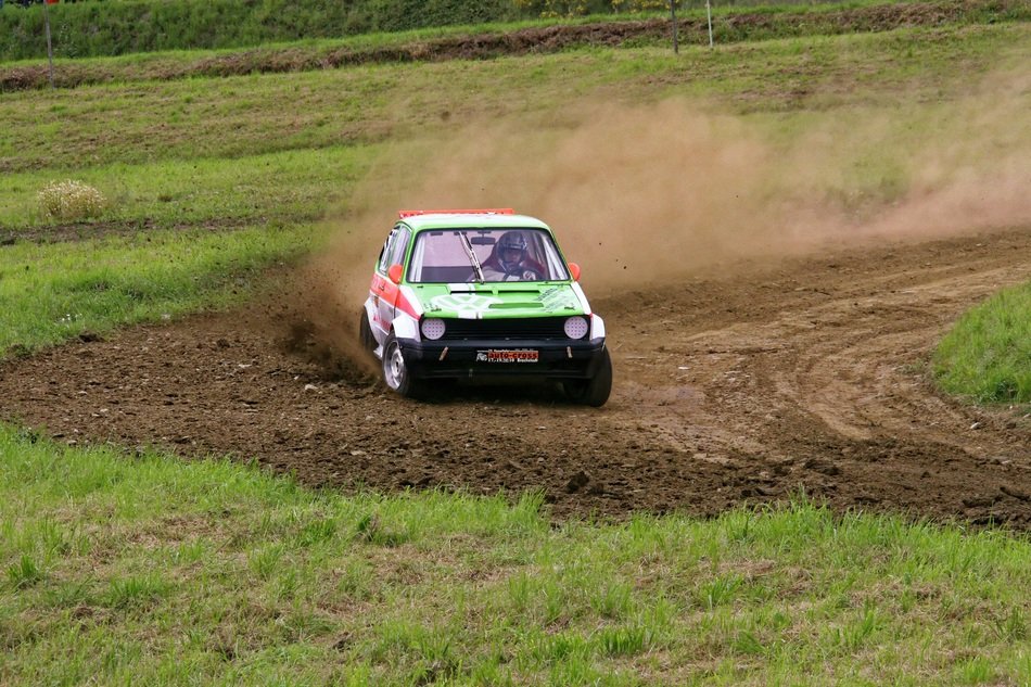 the car is driving on the highway at the turn of the race
