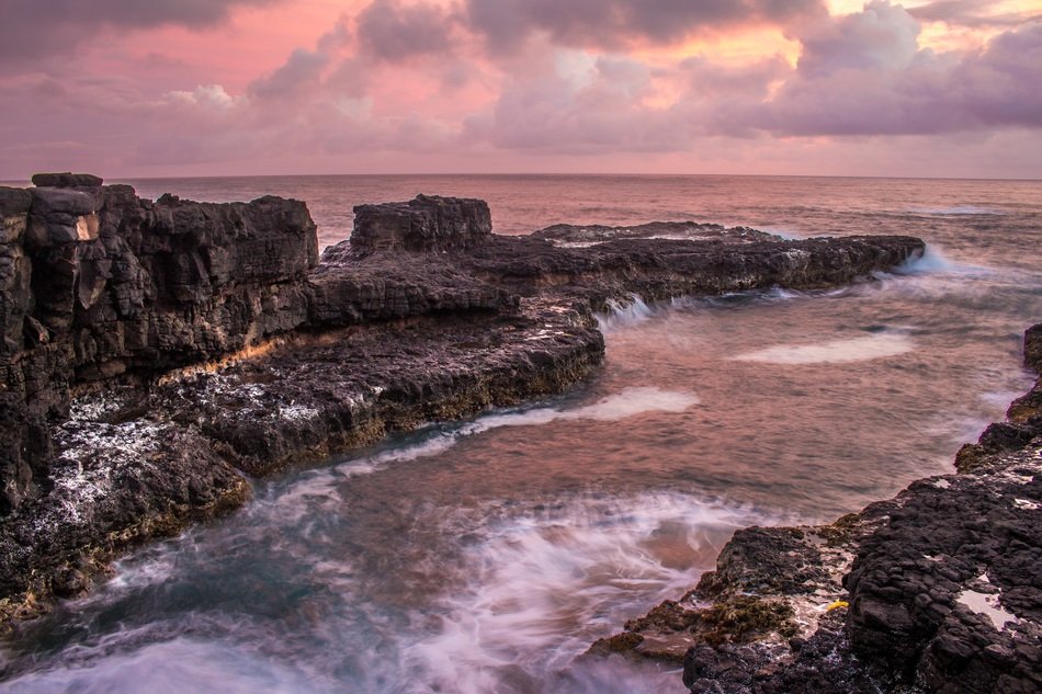 ocean motion sea cliffs waves sunset red color