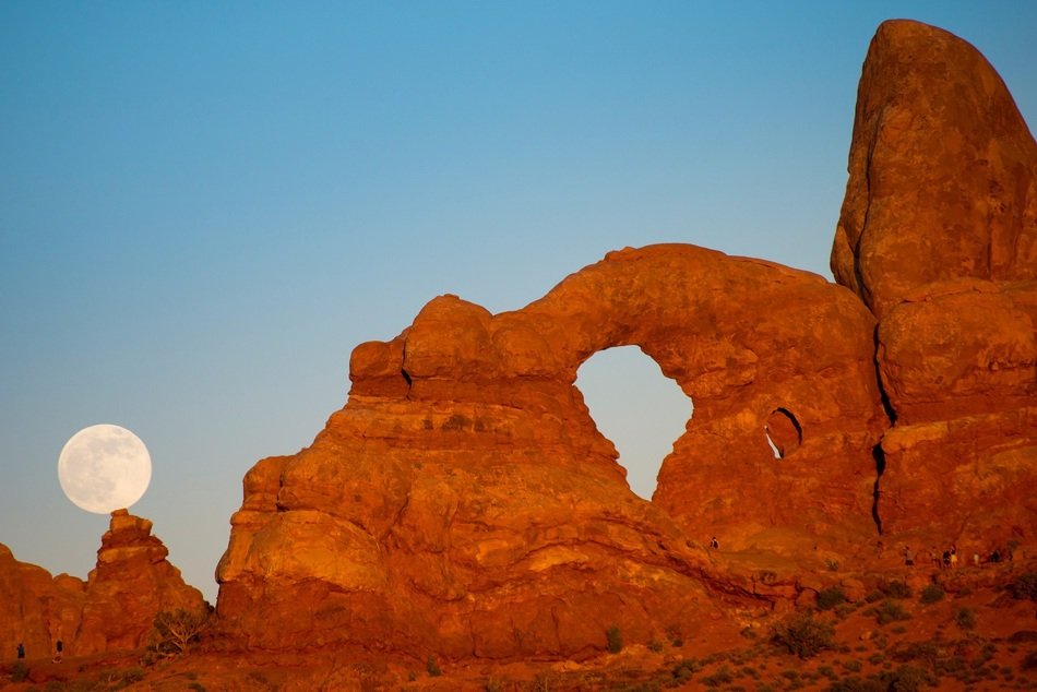 Full moon near the rock arch