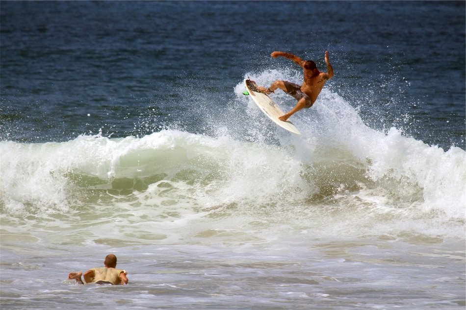 surfer in the foamy spray of the ocean