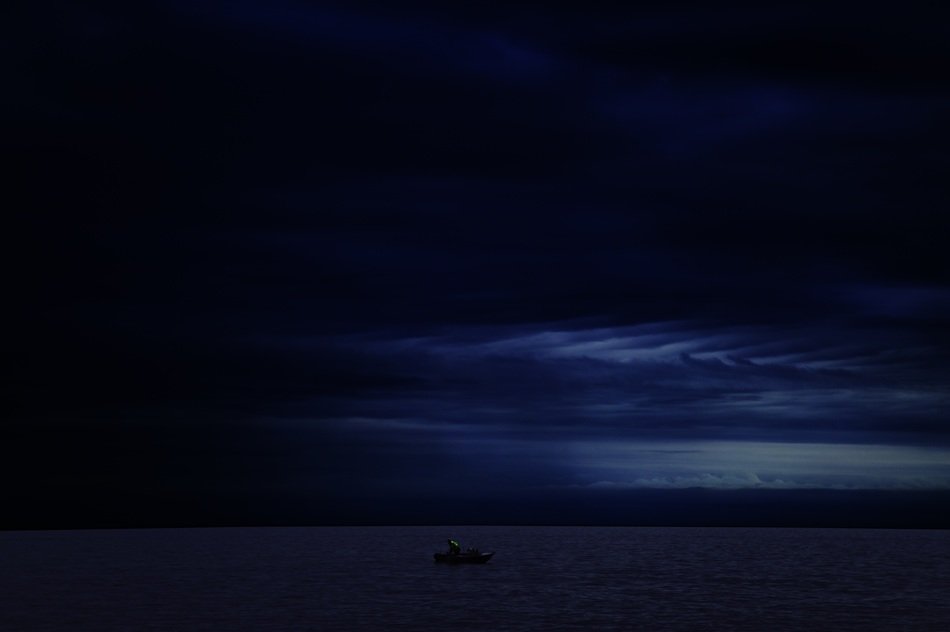 Boat in the ocean at night