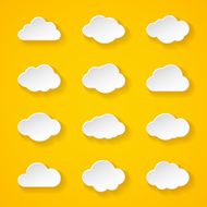 Twelve white paper clouds with different shapes