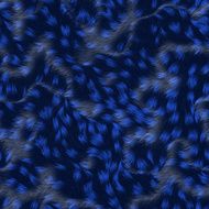 strands of fabric on a soft blue pillow