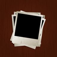 Grunge blank photos on wooden background