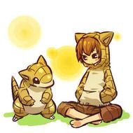 boy and pokemon are sitting on green grass