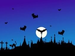 silhouettes of bats in the night sky