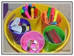 cups of different colors with objects