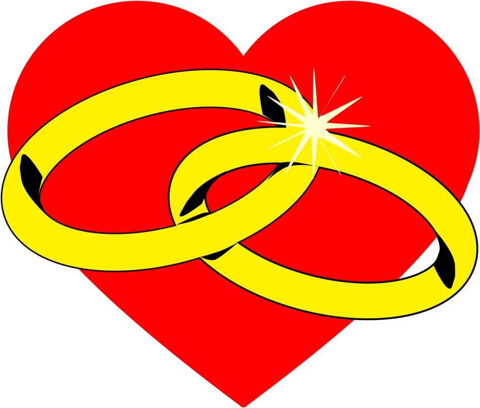 wedding rings on a background of red hearts