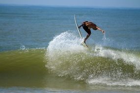 surfer jumping on the wave