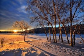 sunset over snowy landscape