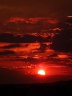 sun among clouds, red evening