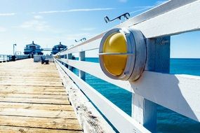 lamp on a white wooden pier