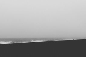 black-and-white photo of landscape of the ocean shore