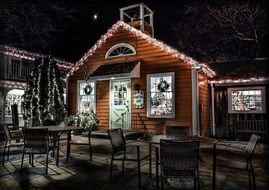 star at night sky above christmas decorated cabin