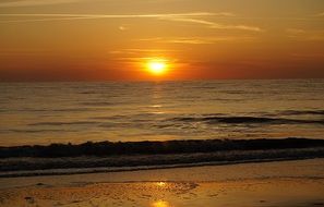 Beautiful glow of orange sunset over the north sea on the island of sylt