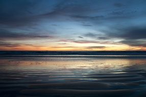 romantic sunset over the calm ocean