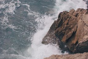 the impact of the waves on the rocks
