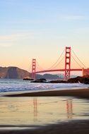 mystic red bridge at the evening ocean