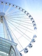 picture of ferris wheel on a background of white clouds