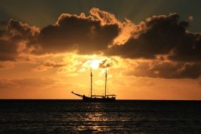 yacht in the sea on a background of bright sunset