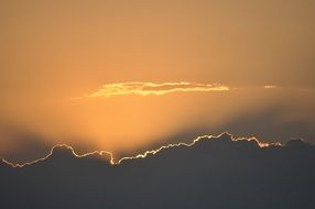 golden sunset behind the clouds