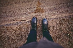 black shoes on sand