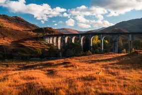 stone bridge among mountains