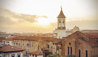 sunset cityscape with bell tower