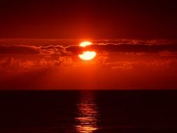 orange sunset over the waters of florida