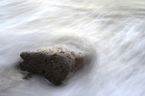 Stone in river flow