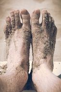 Barefoot on sand on the beach
