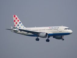 plane "croatia airlines" is flying in the sky