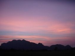 purple-pink sunset over the mountains in Thailand