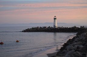 lighthouse harbor stone shore evening