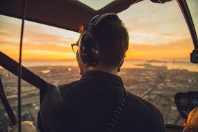 man in helicopter at flight