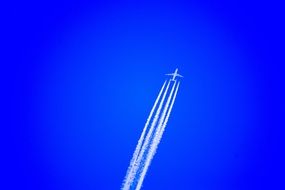 airplane cruising in blue sky