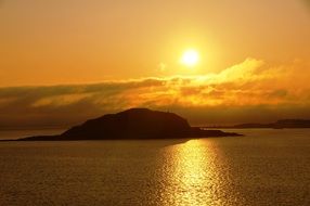 golden sunset over the waters of norway