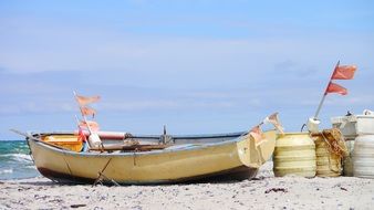 fishing boat with flag on the beach