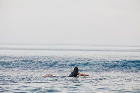 surfing human in ocean